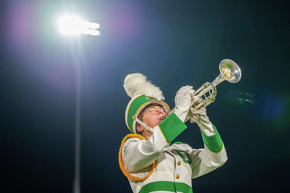 Members of the Dow High Marching Band performs popular songs at the Midland Marching Band Showcase on Oct. 17, 2022 at the Midland Community Stadium. This event brought in eight bands from around the mid-Michigan region to show off their talents.