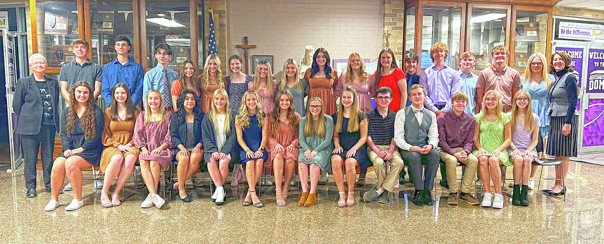 Routt Catholic High School National English Honor Society with Routt teacher and adviser Janet Chipman and Routt teacher Cleta TerHark.