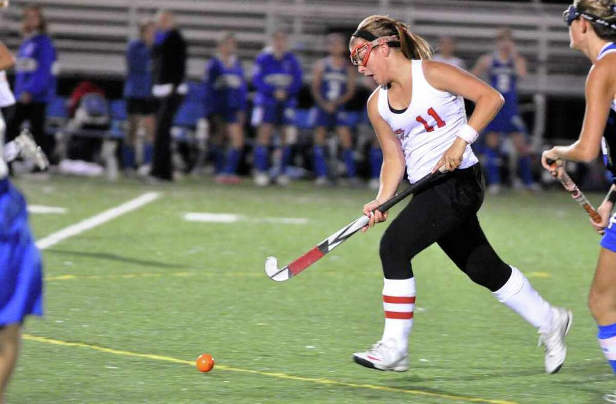 Fairfield Warde's Stacey DiLeo controls the ball during the field hockey game against Fairfield Ludlowe at Warde on Thursday, Oct. 7, 2010.