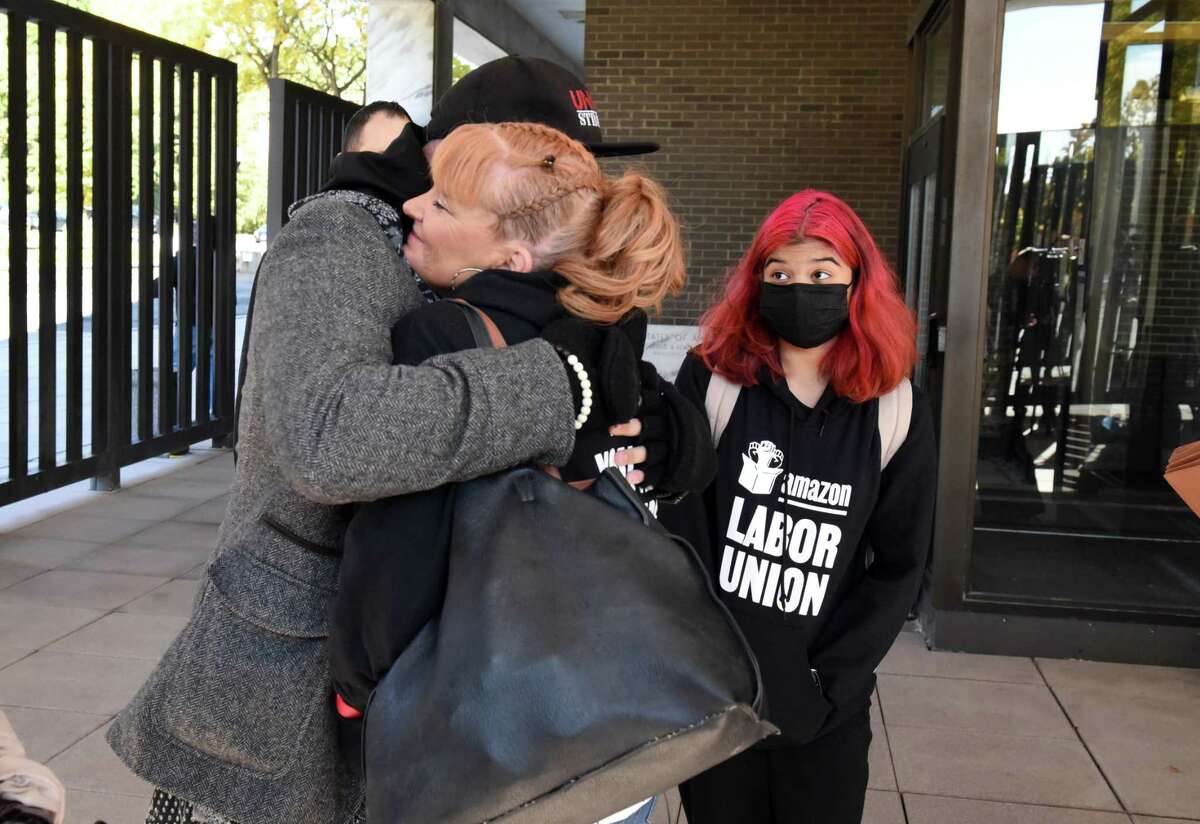 Heather Goodall, the union-drive campaign manager at Amazon's Schodack facility, his hugged by a union official after votes were counted against workers unionizing at the Amazon Schodack warehouse, rejecting the chance to be represented by the newly formed Amazon Labor Union, on Tuesday, Oct. 18, 2022, outside Leo O'Brien Federal Building in Albany, N.Y.