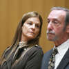 Michelle Troconis, center, who has pleaded not guilty to conspiracy to commit murder in the Jennifer Dulos case, appears in court with her attorney, Jon Schoenhorn, at the Connecticut Superior Court in Stamford, Conn. Tuesday, Oct. 18, 2022.
