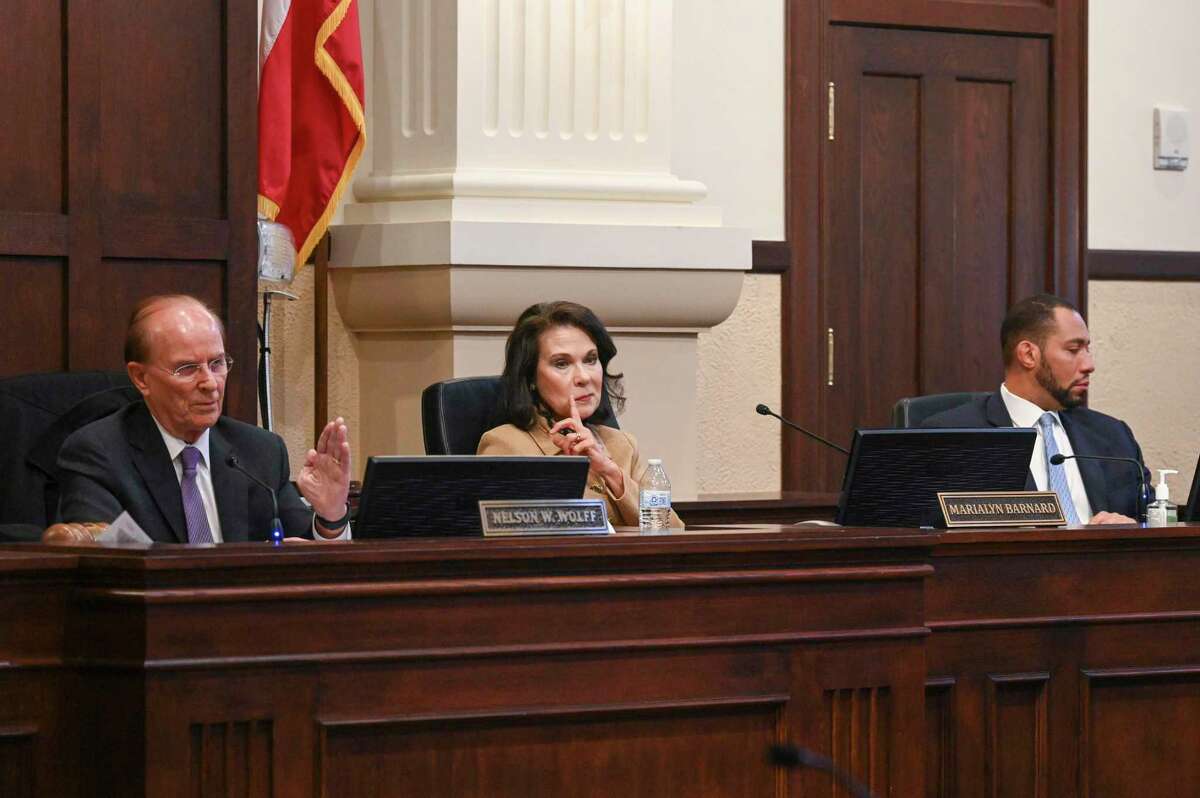 Bexar County Judge Nelson Wolff, left, Commissioner Marialyn Barnard and Commissioner Tommy Calvert vote to increase the number of polling stations to 302 in Bexar County on Tuesday, Oct. 18, 2022.