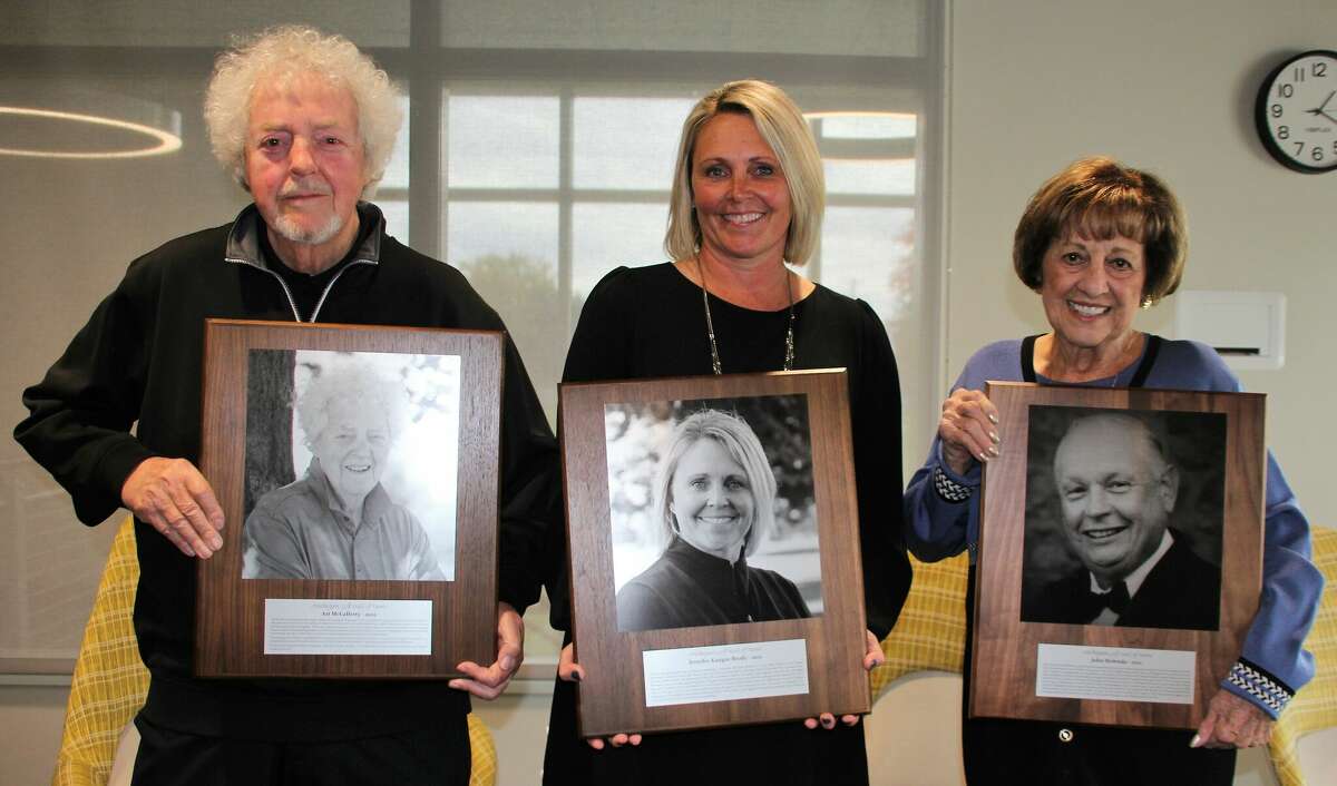 From left, Art McCafferty, Jennifer Kangas-Brody and Shirley, John Molenda’s widow, are with their Hall of Fame Plaques at Katke Golf Course.