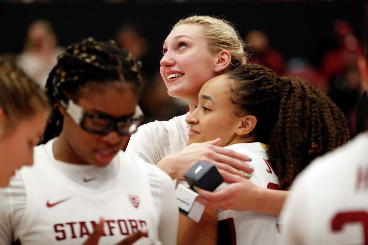 Stanford's Cameron Brink and Haley Jones embrace during National Championship ring ceremony following 61-56 loss to Texas in women's college basketball game at Maples Pavilion in Stanford, Calif., on Sunday, November 14, 2021.