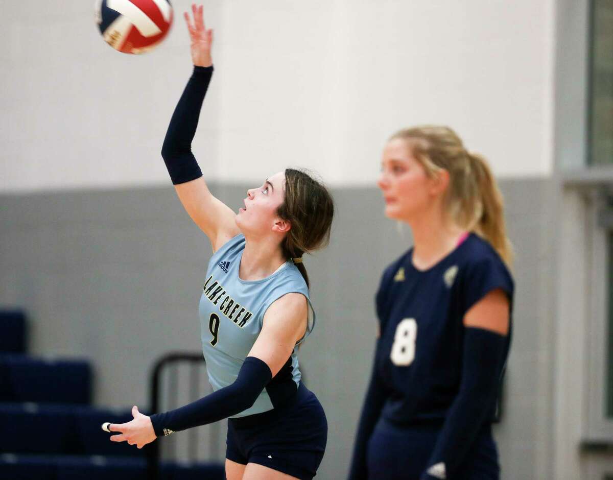 Lake Creek's Emerson Caltabiano (9) serves the ball in the second set of a District 21-5A high school volleyball match at Lake Creek High School, Tuesday, Oct. 18, 2022, in Montgomery.