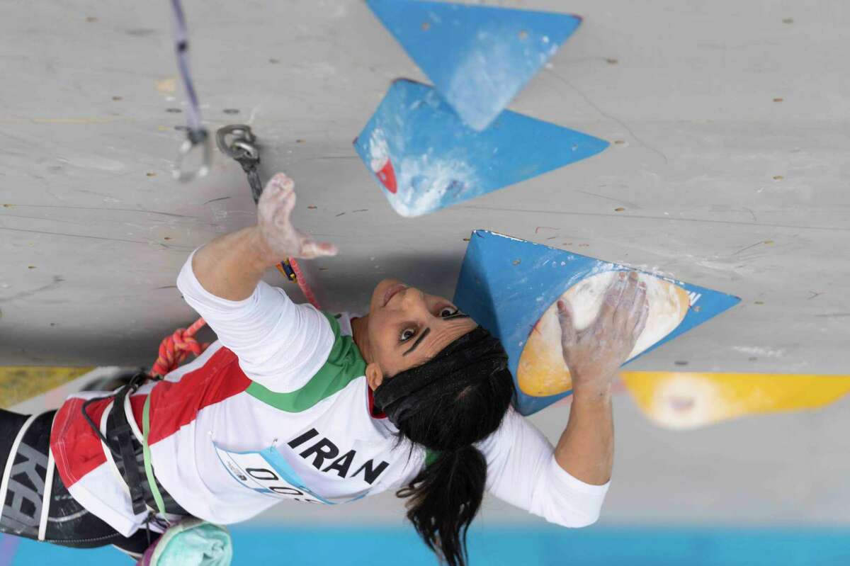 Iranian athlete Elnaz Rekabi competes during the women's Boulder & Lead final during the IFSC Climbing Asian Championships in Seoul, Sunday, Oct. 16, 2022. Rekabi left South Korea on Tuesday, Oct. 18, 2022 after competing at an event in which she climbed without her nation's mandatory headscarf covering, authorities said. Farsi-language media outside of Iran warned she may have been forced to leave early by Iranian officials and could face arrest back home, which Tehran quickly denied. (Rhea Khang/International Federation of Sport Climbing via AP)