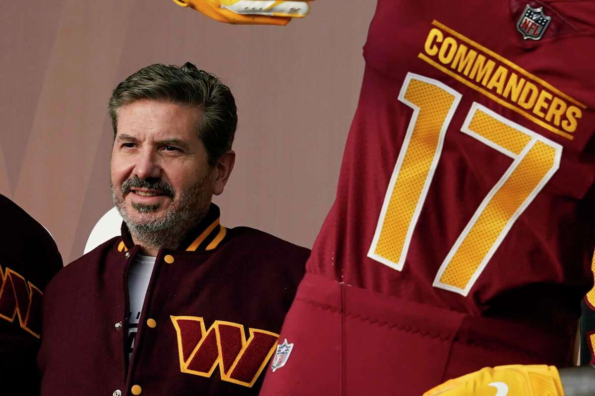 FILE - Washington Commanders' Dan Snyder poses for photos during an event to unveil the NFL football team's new identity, Wednesday, Feb. 2, 2022, in Landover, Md. The Washington Commanders are denying the contents of a report by ESPN detailing Dan Snyder's efforts to influence other NFL owners and the league office to keep control of the team. In a statement sent to The Associated Press on Thursday, Oct. 13, a Commanders spokesperson called it “categorically untrue” and “clearly part of a well-funded, two-year campaign to coerce the sale of the team, which will continue to be unsuccessful.” (AP Photo/Patrick Semansky, File)