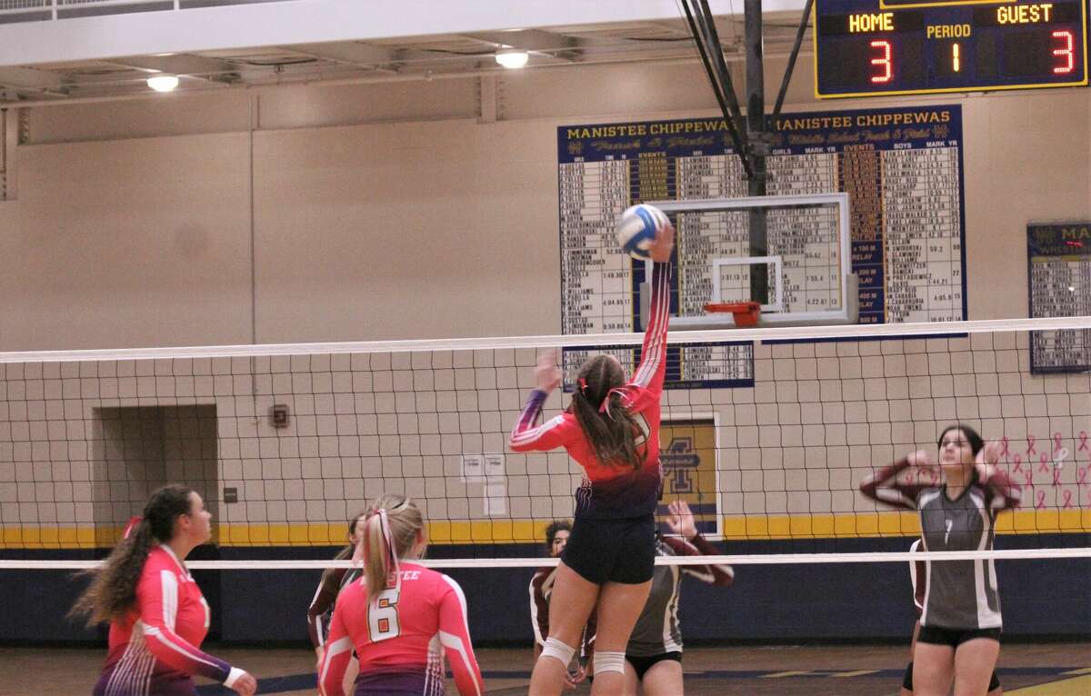 FILE - Manistee senior Allison Kelley (center) places the ball past Muskegon Orchard View's front line on Oct. 18 at Manistee High School.