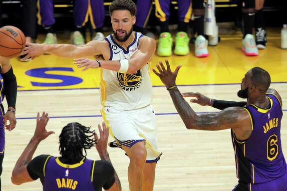 Klay Thompson (11) passes to a teammate in the first half as the Golden State Warriors played the Los Angeles Lakers in their home opener at Chase Center in San Francisco, Calif., on Tuesday, October 18, 2022.