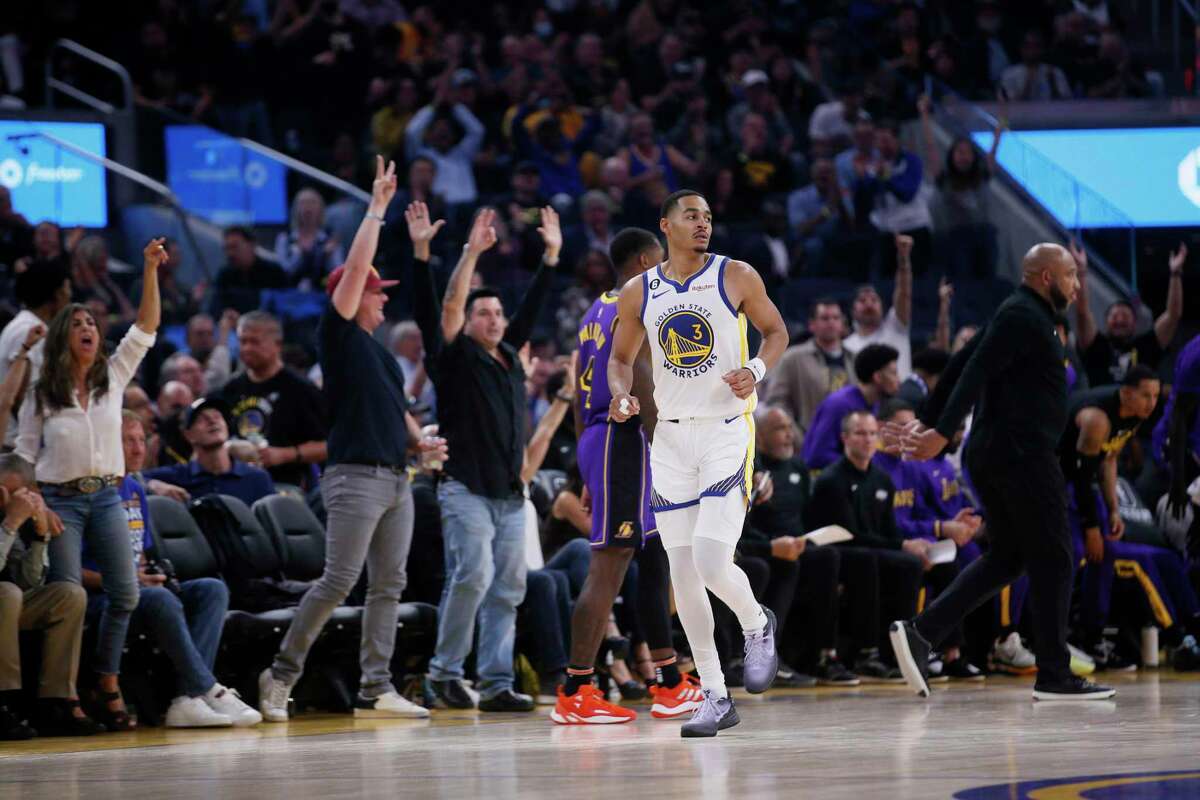 Golden State Warriors guard Jordan Poole (3) scores a three pointer against the Los Angeles Lakers in the first quarter of an NBA game at Chase Center in San Francisco, Calif., Tuesday, Oct. 18, 2022.