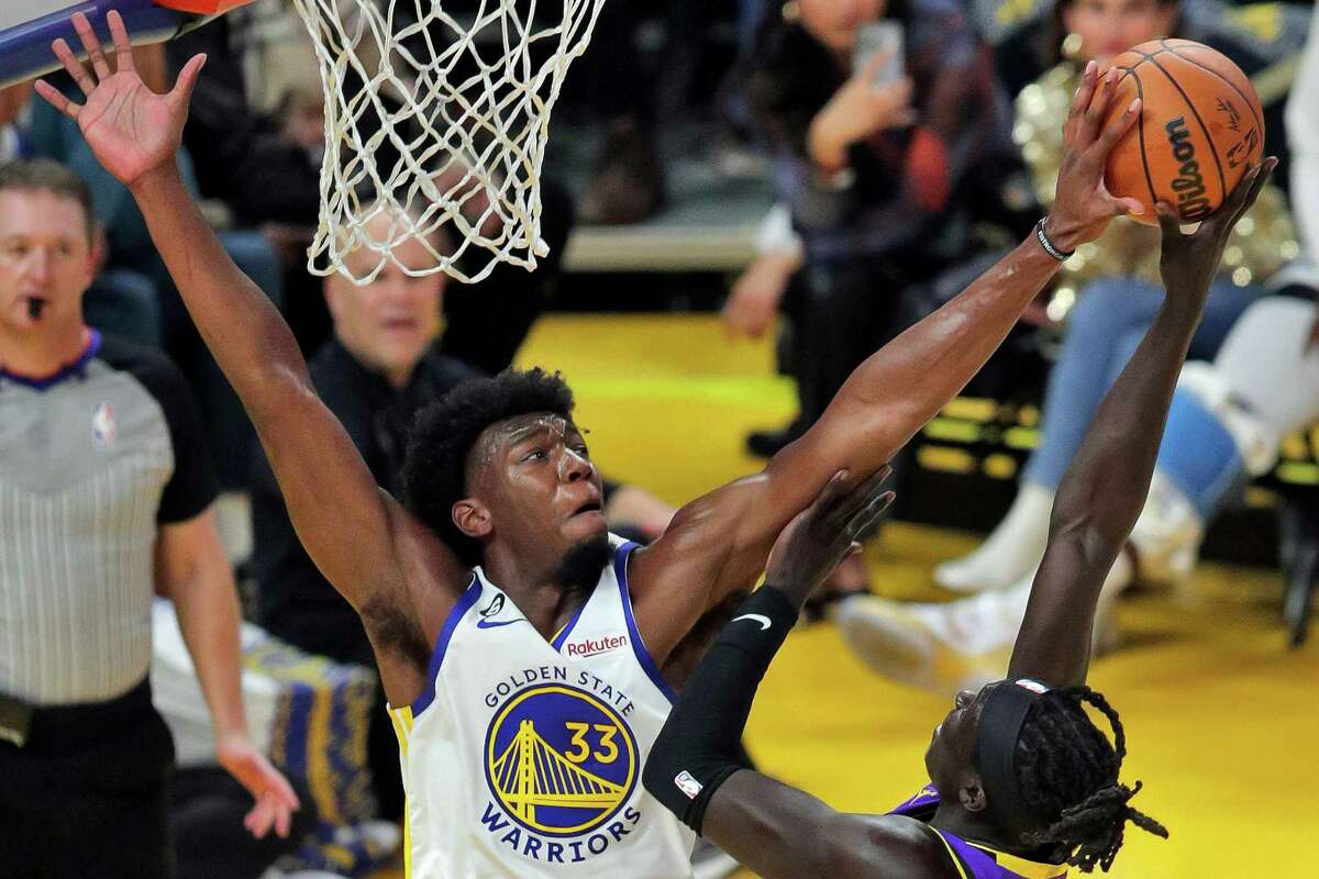 James Wiseman (33) blocks a shot by Wenyen Gabriel (35) in the first half as the Golden State Warriors played the Los Angeles Lakers in their home opener at Chase Center in San Francisco, Calif., on Tuesday, October 18, 2022.