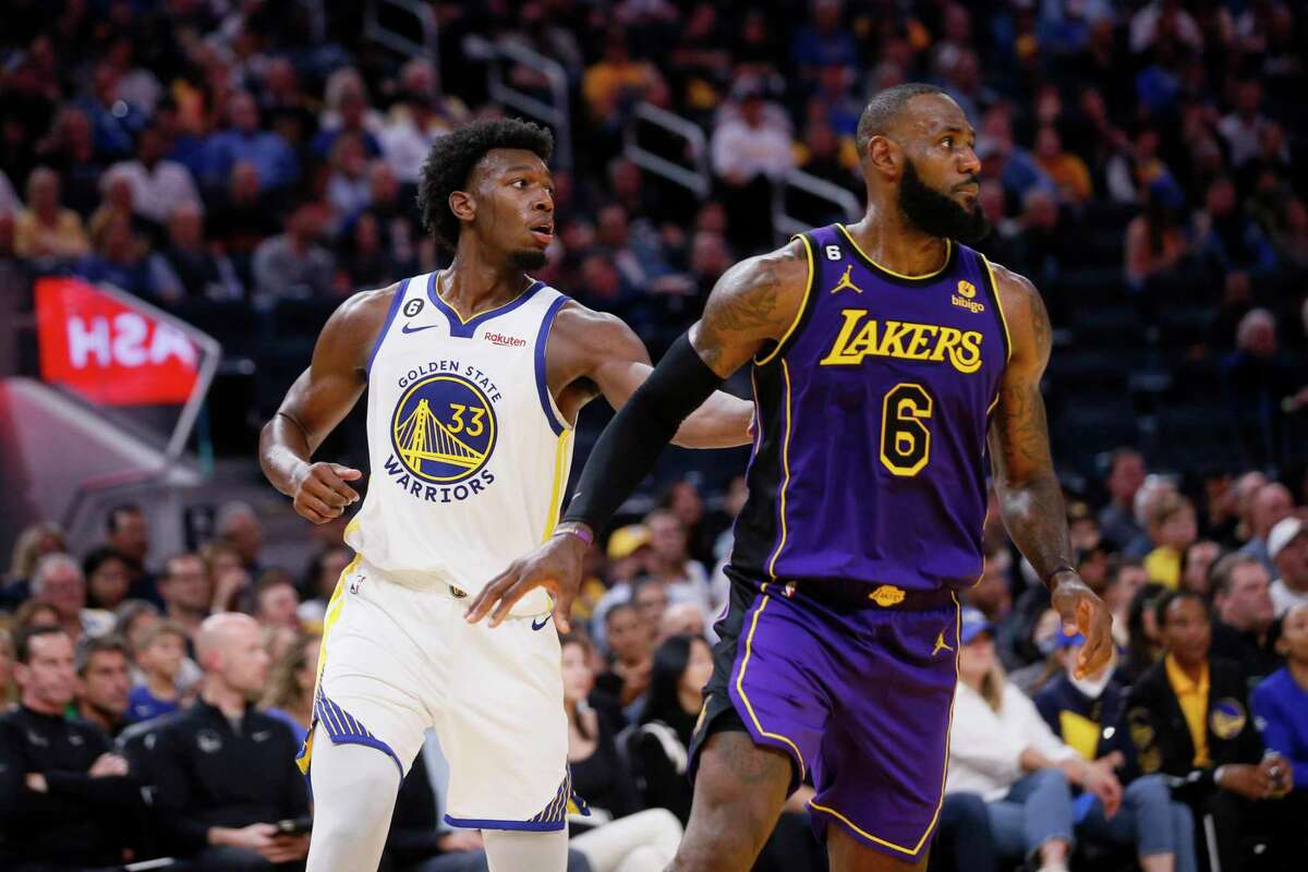 Golden State Warriors center James Wiseman (33) guards Los Angeles Lakers forward LeBron James (6) in the third quarter of an NBA game at Chase Center in San Francisco, Calif., Tuesday, Oct. 18, 2022. The Warriors won 123-109 in their home opener.