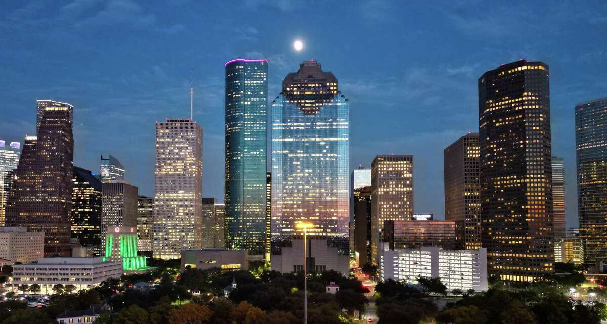 The downtown Houston skyline is photographed from Sabine Street Bridge Thursday, Oct. 6, 2022, in Houston. Real estate investors' perceptions of the city's overall real estate prospects are improving, according to a new report by Urban Land Institute and PwC.