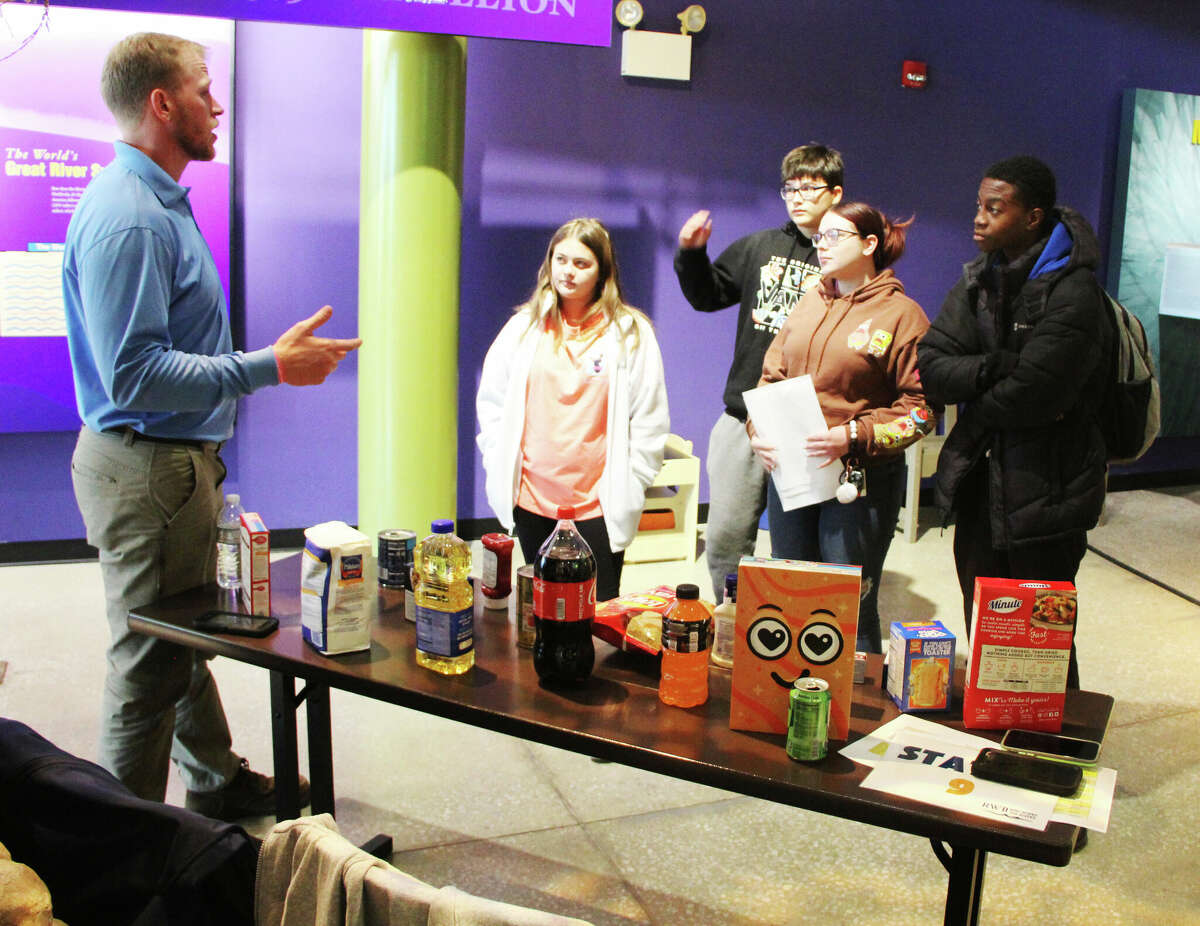 Stephen LeBouef, of ADM in St. Louis, talks about the different products made with commodities shipped via barge on the Mississippi River during “Who Works the Rivers,” at the National Great Rivers Museum in Alton Wednesday. The program brings in representatives of government and industry that provide jobs and services related to the river.