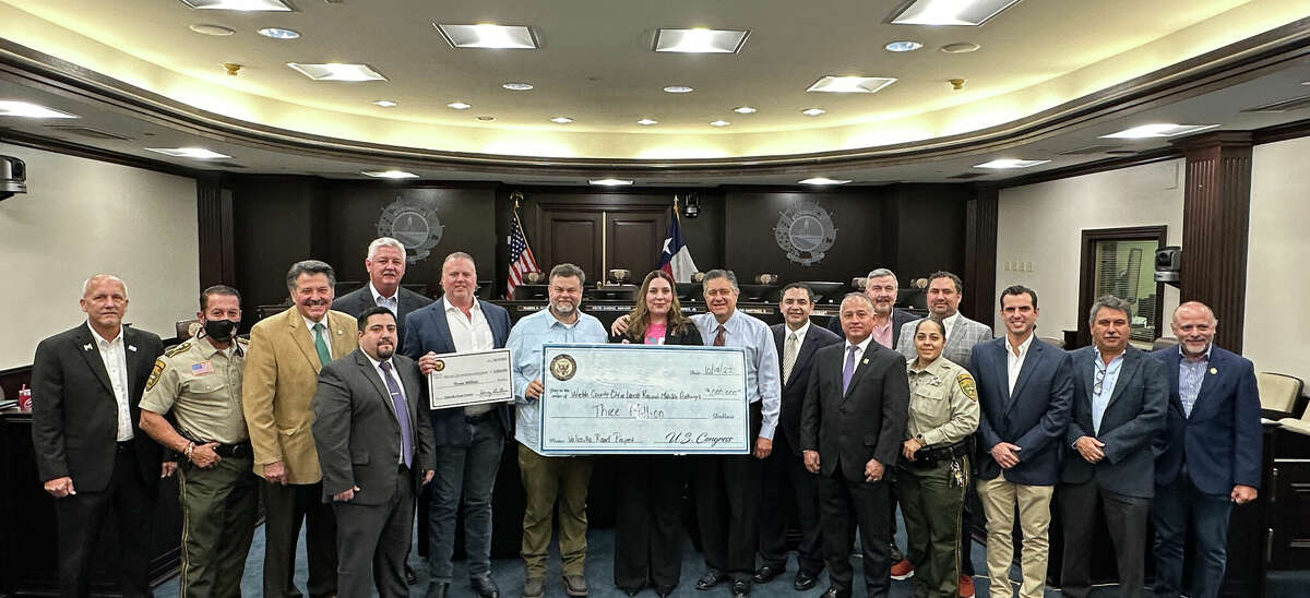 City, state and federal officials and representatives gathered for a photo after the announcement of a $3 million earmark for the Vallecillo Road Project.