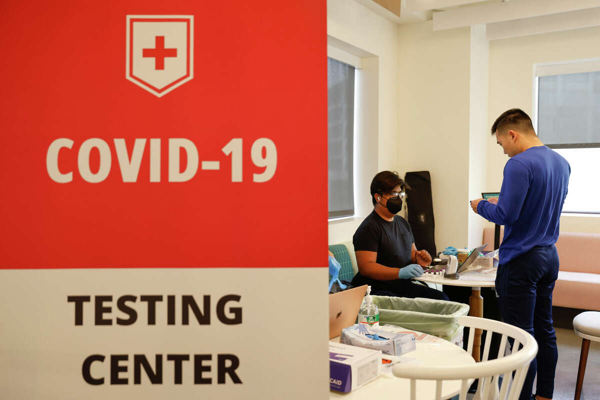 Cody Zeng prepares to take a rapid antigen COVID-19 test at the in-house testing center at the DoorDash offices in San Francisco, Calif. Tuesday, Oct. 18, 2022.