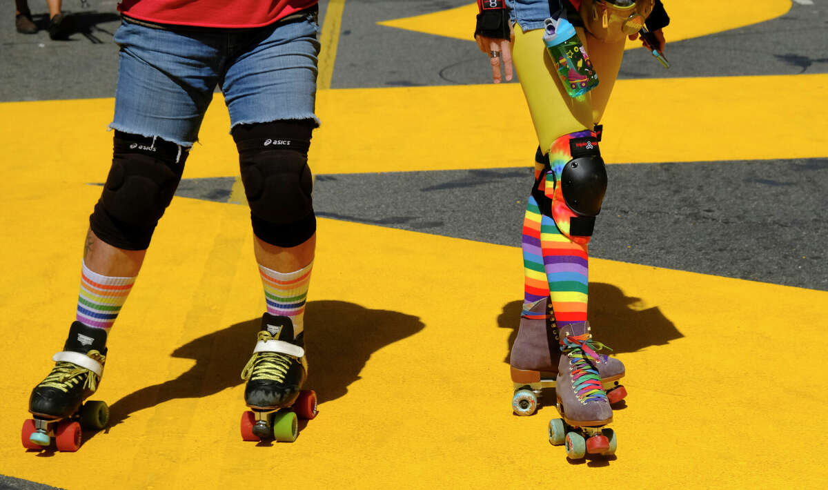 Protesters on roller skates attend the a march.