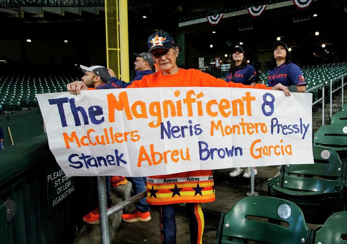 Barbara Moon shows off her sign before Game 1 of the American League Championship Series at Minute Maid Park on Wednesday, Oct. 19, 2022, in Houston.