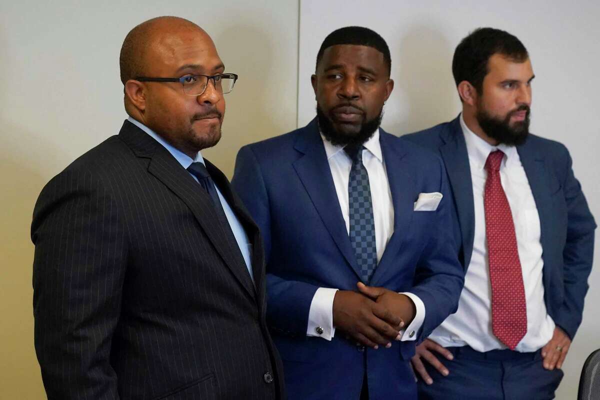 Attorney Lateef Gray (left), shown with fellow attorneys Adanté Pointer and Patrick Buelna, is accused of improperly transferring records from his office laptop to an external storage device on the day the district attorney fired him in a staff shake-up.