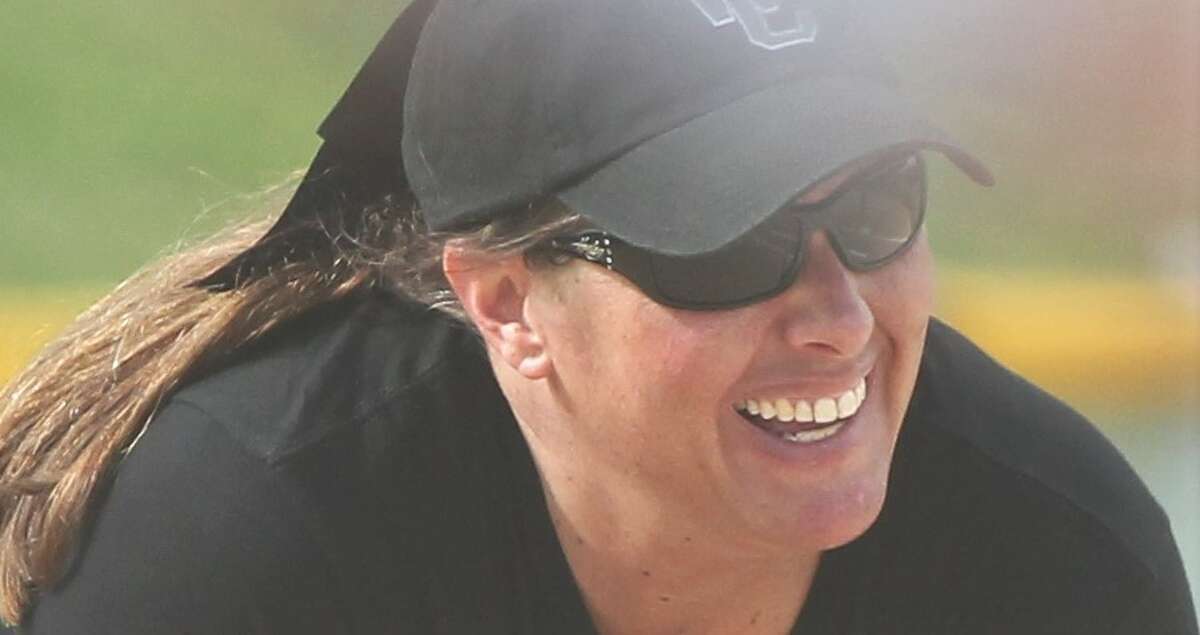 West Central softball coach Kandice Kunkel smiles during a game against Routt in 2021.