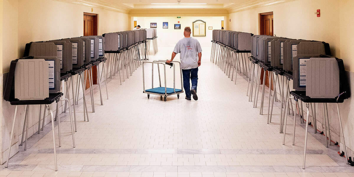 Voting booths line a hallway at San Francisco City Hall in June for the primary election.