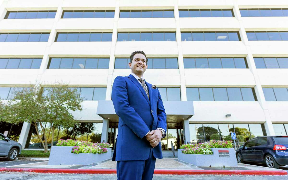 Andrew Berteaux, poses Oct. 5, 2022 outside San Antonio Smart Solutions’ Energy Plaza I building offices. Smart Solutions has been selected at one of the San Antonio Express-News’ Top Workplaces.