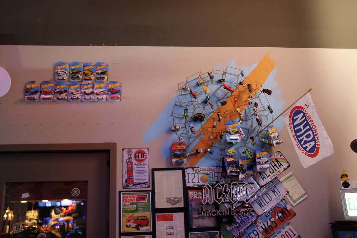 Just a small amount of the automotive memorabilia on the walls of Chappy's Chicken, next to Wang Gang. Kids can get a free classic Hot Wheels car with their meals. 