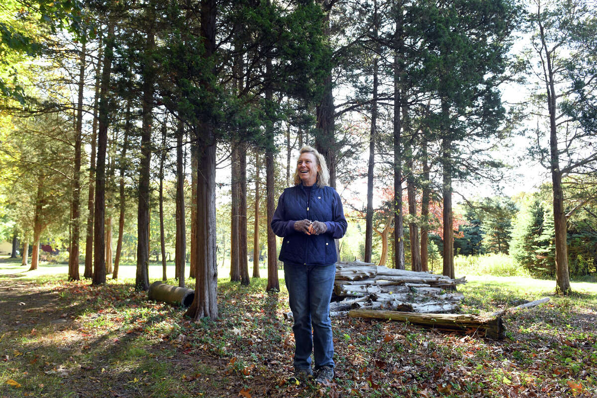 Laura Wells speaks during a tour and interview around her family’s property and neighboring Shelton Land Conservation Trust property, in Shelton, Conn., Oct. 20, 2022.