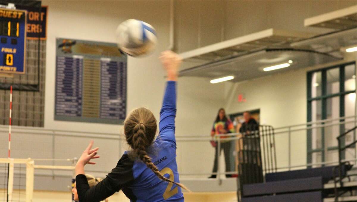 Onekama junior Ashlyn Blackmore delivers a serve against Bear Lake on Oct. 20 at Onekama High School. 