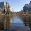 El Capitan and other peaks are seen reflected in the Merced River at Yosemite National Park in March. Research published this week shines light on the age of Yosemite Valley.