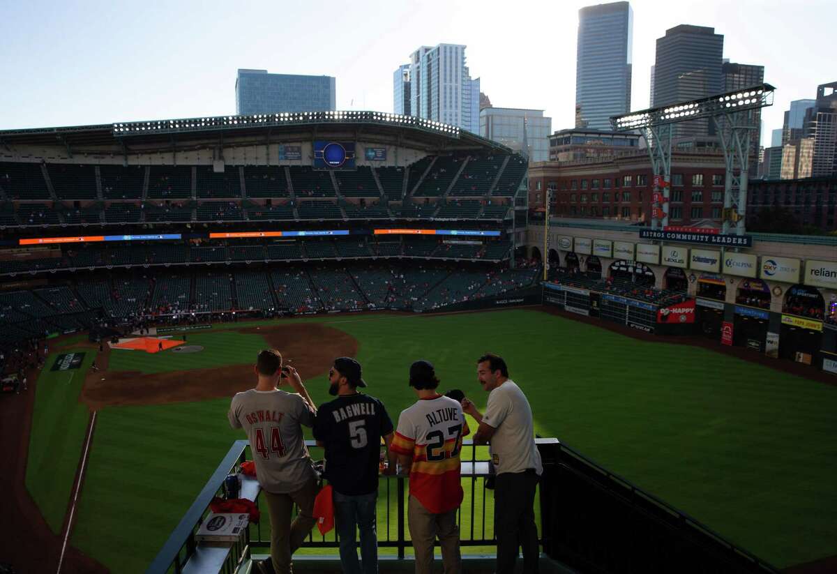 Zach White, from left, James Roecker, Tim San Pablo and Ryan Gunter wait for Game 2 of American League Championship Series between Houston Astros and New York Yankees Thursday, Oct. 20, 2022, at Minute Maid Park in Houston.