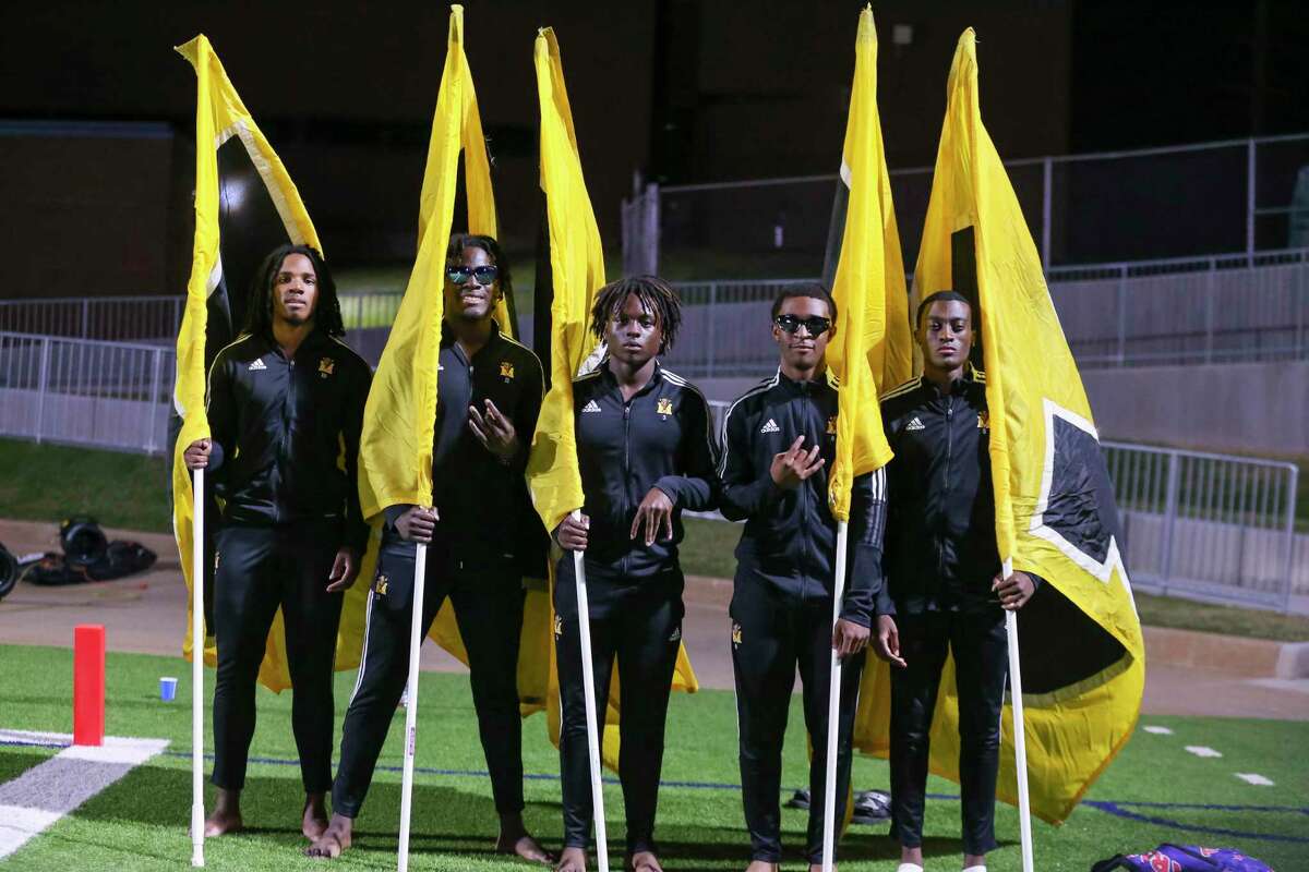 Marshall Buffalos flag runners, Landon Fobbs, Onyinye Okeleke, Lucky Obor, Jaiden Lewis & Corinthian Owens pose in the first half of a District 9-5A Division II high school football game between the Marshall Buffs and the Willowridge Eagles at Mercer Stadium in Sugarland, TX on Thursday, October 20, 2022.
