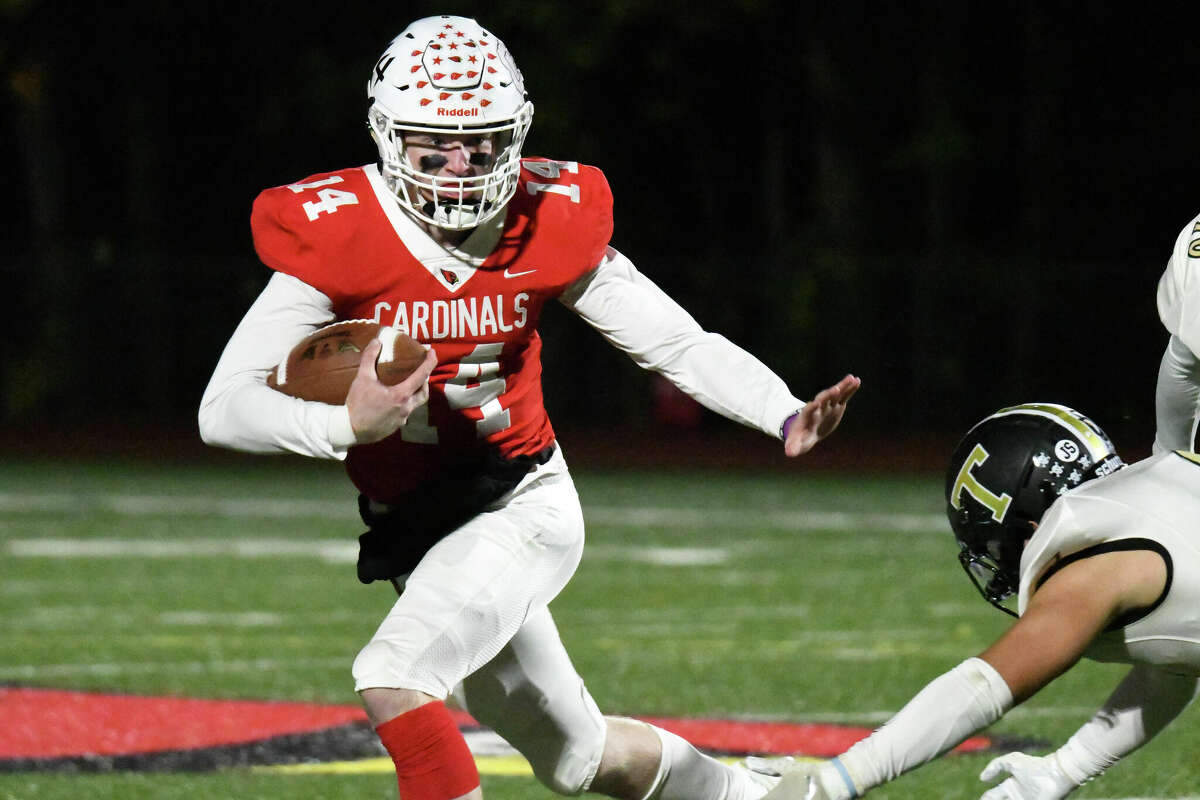 Greenwich's Jack Wilson runs with the ball during a football game between Greenwich and Trumbull at Cardinal Stadium, Greenwich on Thursday, Oct. 20, 2022.