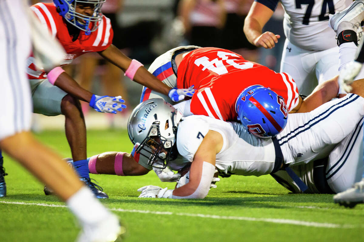College Park RB Brenton Martinez (7) reaches for the goal line but is stopped by Oak Ridge DL Caden Zeamer (34) in the first half of action during a District 13-6A high school football game between Oak Ridge vs College Park at Woodforest Bank Stadium in Shenandoah, TX, October 20, 2022.