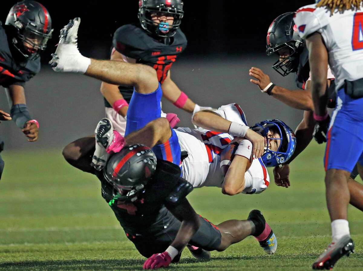 Wagner William Gaddis (4) upends Hays QB Tyler McInvale (12) in the first quarter on Thursday, Oct. 20, 2022 at Rutledge Stadium