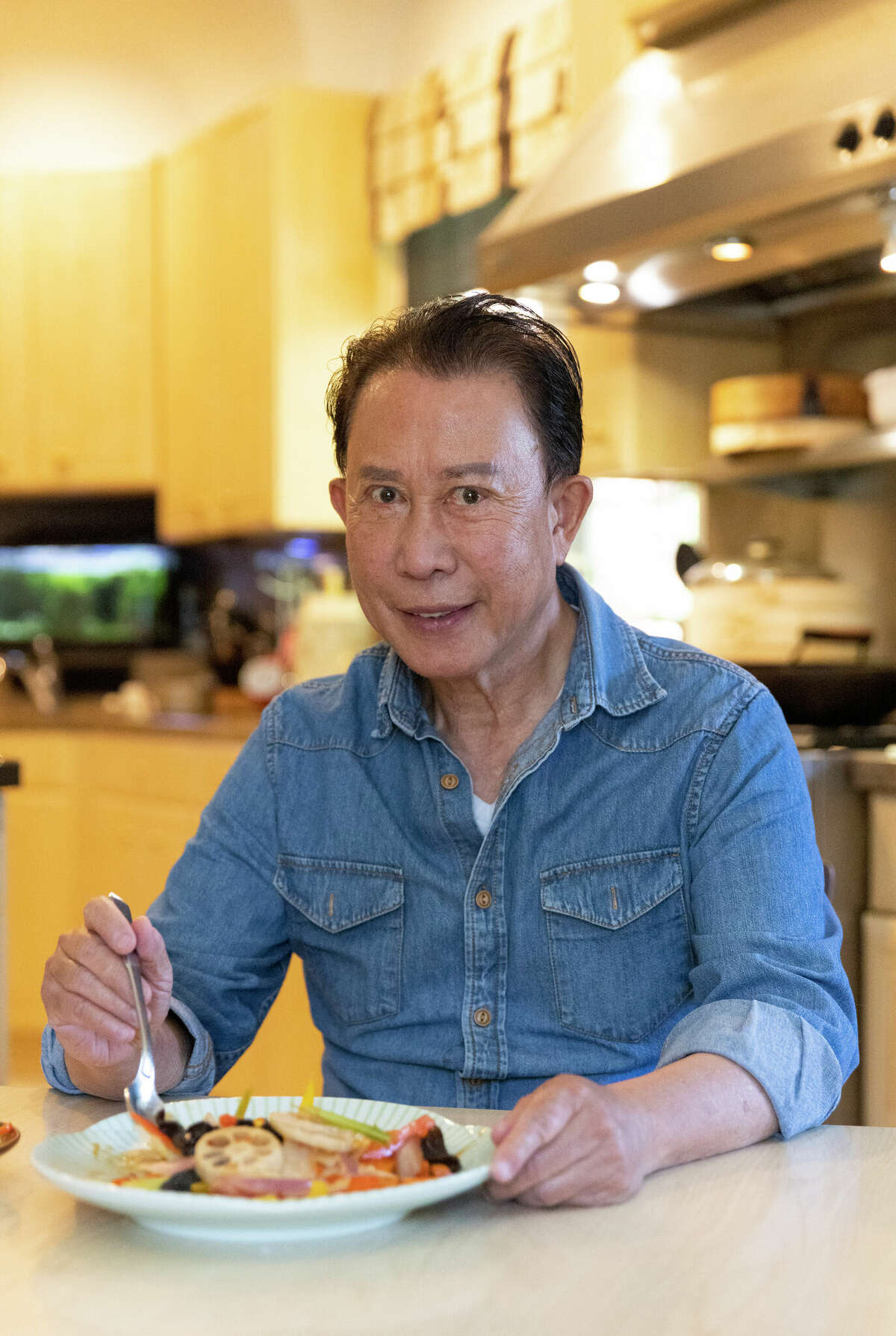 Chef Martin Yan says his home-prepared meals include at least two vegetable dishes. He has been teaching people how to cook Asian cuisines for decades.