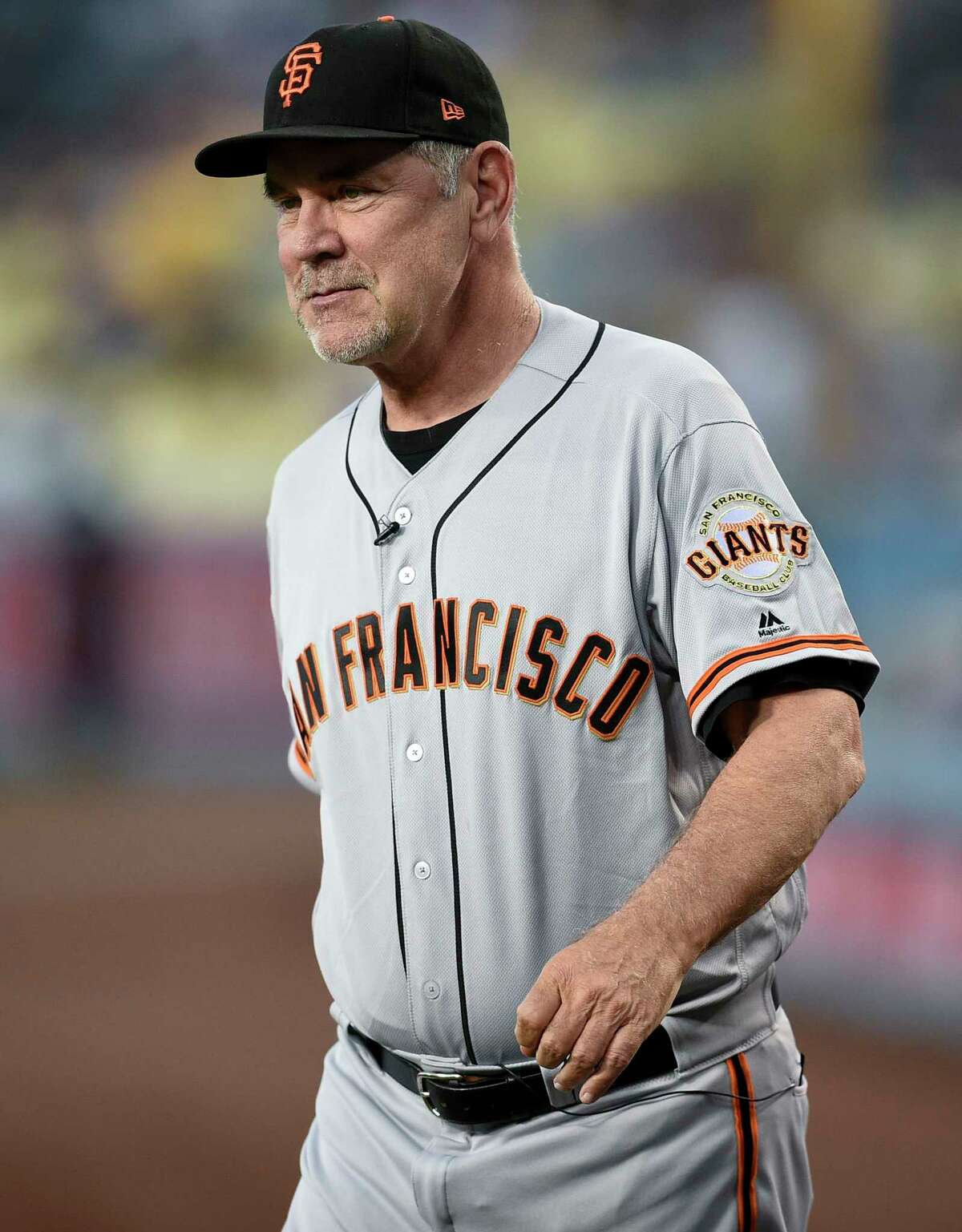 FILE - San Francisco Giants manager Bruce Bochy walks onto the field prior to a baseball game against the Los Angeles Dodgers in Los Angeles, Friday, Sept. 6, 2019. The Texas Rangers have hired Bruce Bochy as their new manager, bringing the three-time World Series champion out of retirement to take over a team that has had six consecutive losing seasons. Texas made the surprise announcement Friday, Oct. 21, 2022, just more than two weeks after its season ended.