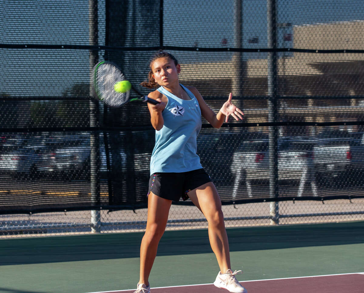 Clements' Gabie Escamos hits the ball during a Region III-6A final at Deer Park HS.