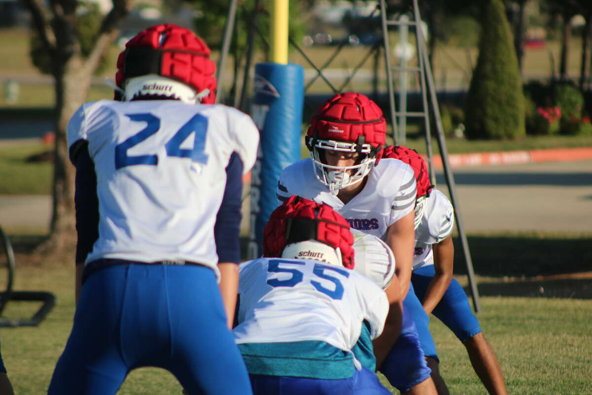 FBCA quarterback Noah Gasque prepares to run a play during a Wednesday practice. Gasque is also a returning First Team All-State linebacker for the unbeaten Warriors.