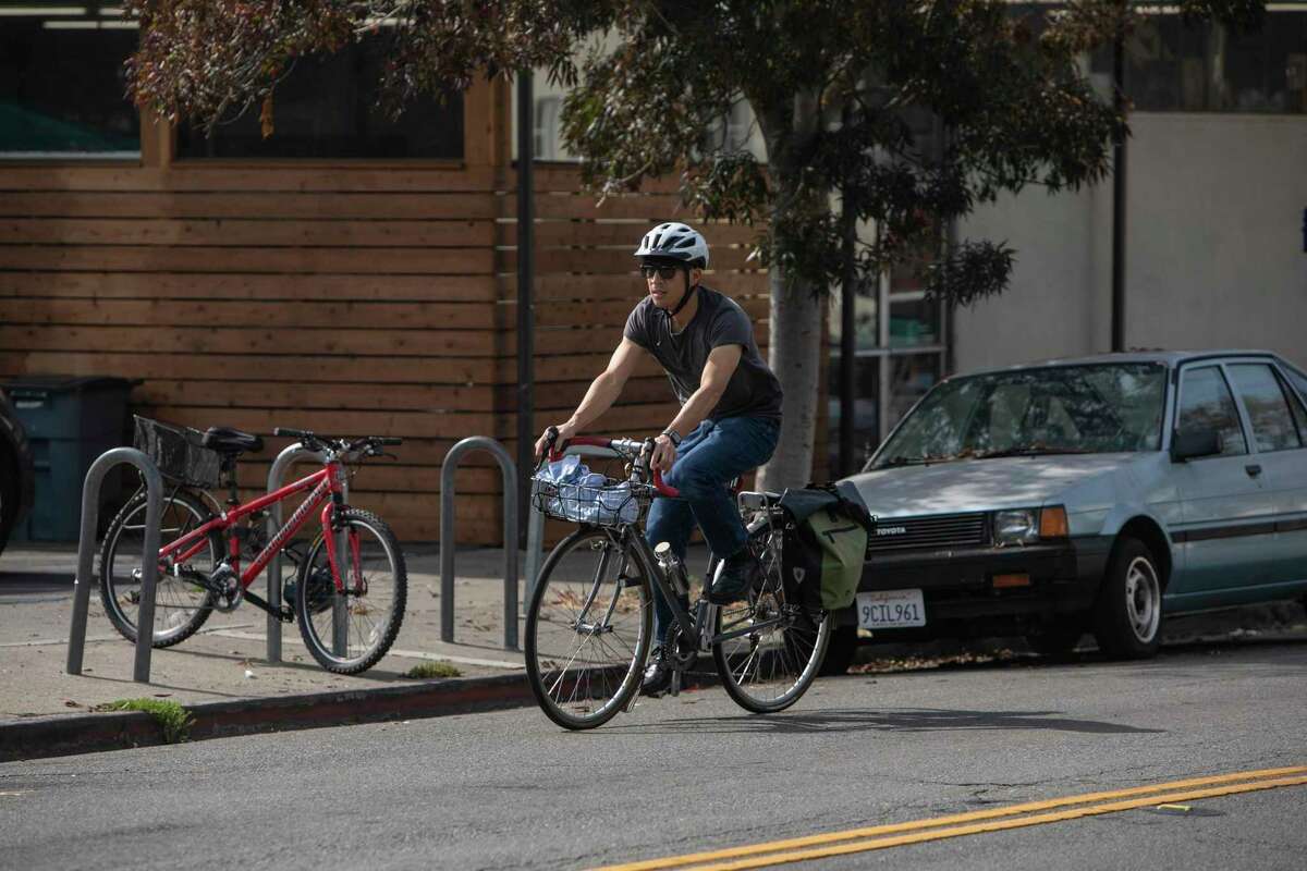 A cyclist rides down Hopkins Street in Berkeley, where a protected bike lane was tenuously approved by the City Council.