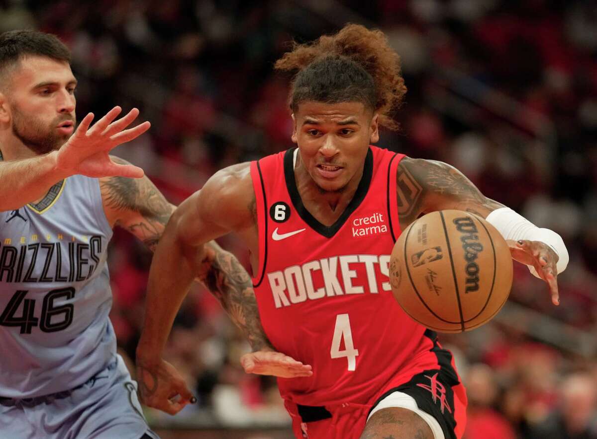 Houston Rockets guard Jalen Green (4) dribbles while Memphis Grizzlies guard John Konchar (46) is defensing during the third quarter of a NBA game Friday, Oct. 21, 2022, at Toyota Center in Houston. Houston Rockets lost to Memphis Grizzlies 129-122.