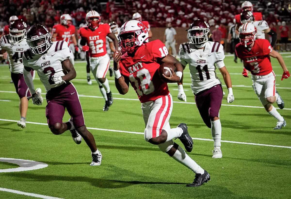 Katy Tigers running back Dallas Glass (18) rushes for a touchdown during the second half of a high school football game against the Cinco Ranch Cougars on Friday, Oct. 21, 2022, at Rhodes Stadium in Katy.