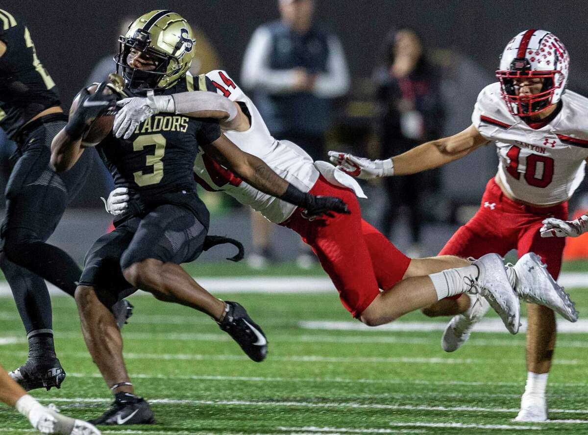 Seguin’s Devin Matthews is tackled Friday night, October 21, 2022, by Canyon’s Collin Ott during the first half of the Matadors’ game against the Cougars in Sequin.