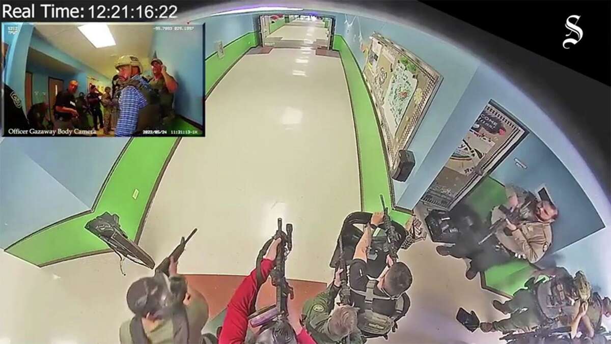 The video, obtained by the Austin American-Statesman and KVUE, shows the confusion inside Robb Elementary School as police stand outside classrooms.