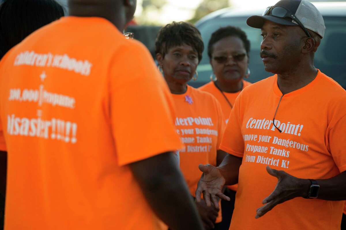 Kennith Burgess, right, meets with area residents outside Our Savior's Church on Thursday, Oct. 20, 2022, in Houston. Burgess has lived in District K since 1994. He and a group of residents' are fighting back against a new CenterPoint propane storage facility due to concerns over gas leaks and explosions.