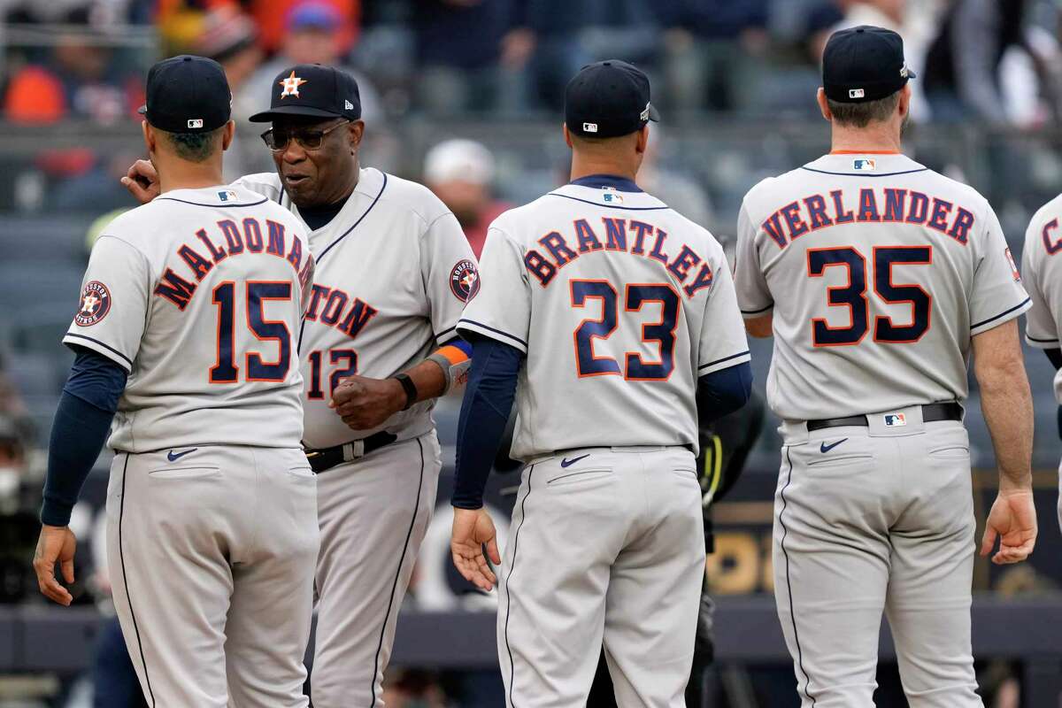 Houston Astros manager Dusty Baker Jr. (12) gets fist-bumps from Martin Maldonado (15) beside Michael Brantley and pitcher Justin Verlander (35) Before Game 3 of the American League Championship Series at Yankee Stadium on Saturday, Oct. 22, 2022, in New York.