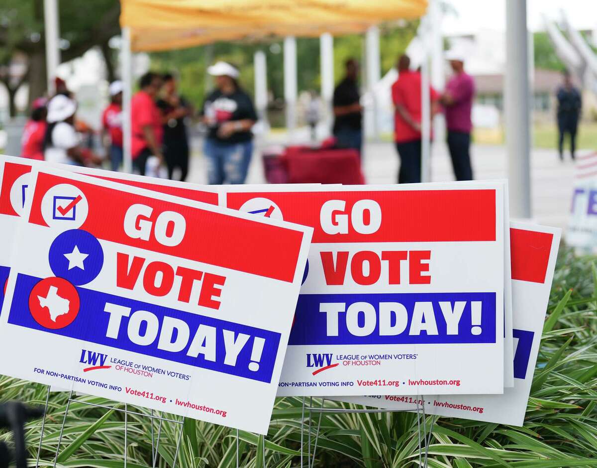 Voting signs on display at Emancipation Park during a rally on Saturday, Oct. 22, 2022 in Houston. The event was hosted by League of Women Voters Houston along with other organizations to urge registered voters to get out and vote.
