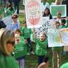 Dwight School students and their parents rally to save their school on the Sherman Green in Fairfield, Conn. on Saturday, October 22, 2022.