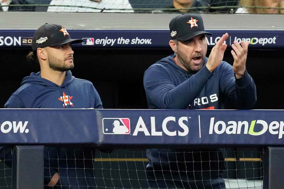 Houston Astros pitcher Justin Verlander, right, applauds beside Lance McCullers Jr. after starting pitcher Cristian Javier struck out New York Yankees Josh Donaldson to end the second inning during Game 3 of the American League Championship Series at Yankee Stadium on Saturday, Oct. 22, 2022, in New York.