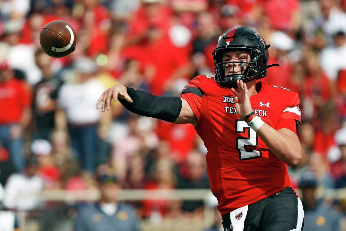 Texas Tech's Behren Morton (2) passes the ball during the first half of an NCAA college football game against West Virginia, Saturday, Oct. 22, 2022, in Lubbock, Texas.